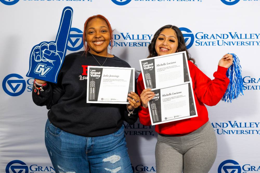 individuals smiling with 3 certificates